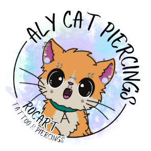 a text circle that reads: aly cat piercings of RocArt Tattoo & Piercing with an orange and cream cartoon cat with big eyes and lots of facial piercings and a collar with an "A" all on top of a tie dye blue and green transparent background